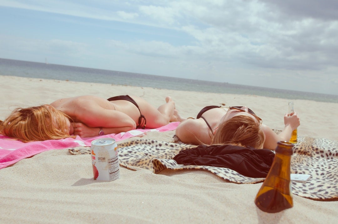 Girls Sunbathing on the Beach